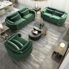 a living room filled with green velvet couches and chairs next to a coffee table