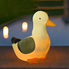 a duck shaped light sitting on top of a table