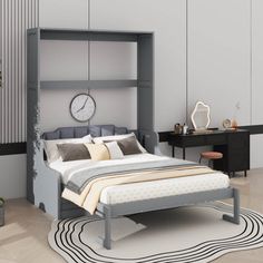 a bedroom with a bed, desk and chair next to a wall mounted clock on the wall