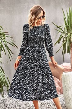 Femme meets fancy in the Trading Places Floral Midi Dress in black that features a flowy skirt. Size Guide: Tina is 5’65” tall, and has a 33.6” bust, 24.1” waist, & 35.2” hips. She is wearing a S / US 4 / AU 8. This dress is true to size. Material: 100% Viscose. Feature: High neckline. Midi length. Smocked bodice. Black Knee-length Floral Dress For Garden Party, Black A-line Dress With Floral Print, Flowy Floral Print Knee-length Midi Dress, Black A-line Maxi Dress For Brunch, Party Floral Print Maxi Dress, Flowy Floral Midi Dress, Spring Black Maxi Dress For Day Out, Fit And Flare Floral Midi Dress For Garden Party, Fit And Flare Midi Floral Dress For Garden Party