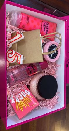 a pink box filled with lots of different items