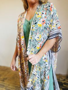 Beautiful duo tone floral print with a border on the lightweight kimono. 100% Viscose APPROX. L 38" W 40" Multicolor Floral Print Kimono One Size, One Size Multicolor Floral Print Kimono, Summer Floral Print Kimono For Brunch, Multicolor Spring Kimono For Brunch, Spring Multicolor Kimono For Brunch, Spring Brunch Multicolor Kimono, Summer Kimono With Floral Print For Brunch, Long Patterned Floral Print Kimono, Long Patterned Kimono With Floral Print