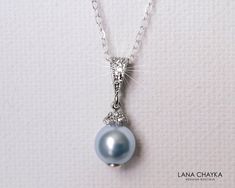 Wedding Swarovski 8mm Light Blue Pearl Drop Pendant with .925 Sterling Silver Chain Bridal Necklace. CHAIN is 18 inches (45.7cm) long. PENDANT is about 0.75 inch (2cm) long including bail. Elegant and timeless, this dainty necklace is perfect for weddings or special occasions such as birthdays, anniversaries, graduations, proms...or whatever you can imagine! Handmade necklace, is made with .925 Sterling Silver 18 inches cable chain, Swarovski 8mm Light Blue round crystal pearl, Rhodium Sterling Bridesmaid Blue, Blue Pearl Necklace, Pearl Silver Necklace, Pearl Drop Pendant, Single Pearl Necklace, Bridal Pearl Necklace, Silver Pearl Necklace, Blue Pearl, Long Pendant