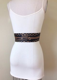 "Wide Black & Gold Chain Sash Belt Black and Gold Sash Gold Chain Link Belt Chain Link Sash Black and Gold Dress Sash Satin Swank Instantly update your jeans, dress, or top with this Satin Swank® black and gold chain print sash belt. Depending on your waist size and the length you choose (60, 75, and 90 inch lengths available), you can wrap this sash around your waist once or twice. You decide whether to tie the sash in a bow or a simple knot with long-hanging tails. Tie in front, in back, o Gold Sash, Black And Gold Dress, Belt Chain, Black Watch Tartan, Black Gold Chain, Satin Sash, Dress Sash, Taffeta Dress, Christmas Family Photos