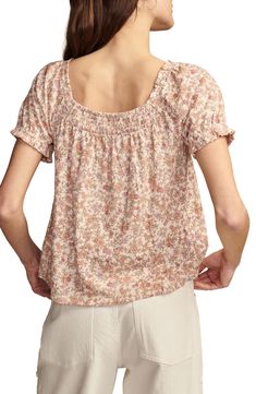 A cascading pattern of earthy flowers enlivens this all-cotton peasant top cut in a lightweight, flowy silhouette with smocked detail at the front and back. Square neck Short sleeves 100% cotton Machine wash, tumble dry Imported Spring Flowy Peasant Top With Smocked Back, Bohemian Blouse With Floral Print And Relaxed Fit, Bohemian Summer Tops For Gatherings, Cottagecore Cotton Blouse With Floral Print, Spring Floral Print Blouse For Gatherings, Cotton Peasant Top For Gatherings, Flowy Peasant Top With Floral Print, Bohemian Peasant Top With Smocked Bodice, Cottagecore Floral Cotton Blouse