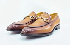 Style: 509-28-Cognac Elegant Burnished Calfskin slip-on Loafer from the Carrucci collection features a Double Gore for your perfect fit, soft Calfskin lining, Horsebit Hardware detailing, and a clean welt! Elegant Cognac Slip-on Moccasins, Elegant Cognac Moccasins For Business, Elegant Brown Slip-on Monk Strap Shoes, Elegant Cognac Slip-on Leather Shoes, Elegant Cognac Leather Slip-on Shoes, Brown Formal Slip-ons, Formal Brown Slip-on Shoes, Formal Brown Slip-ons, Elegant Brown Moc Toe Moccasins