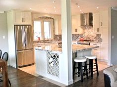 an image of a kitchen with white cabinets and marble counter tops on pinterest