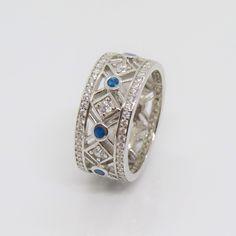 Vintage Sterling Silver Blue Opal & White Topaz Wedding Band Ring ...Marked 925...Total of weights 5.6grams...Size 6.5...Measure of band 8.7MM...It's in very good condition. Blue Jewelry With Channel Set For Wedding, Blue Channel Set Wedding Ring, Blue Wedding Ring With Channel Set, Blue Wedding Ring Channel Set, Blue Hallmarked Opal Ring For Wedding, Classic Silver Opal Ring With Multi-stone, Vintage Silver Multi-stone Opal Ring, Blue Opal Ring In Sterling Silver, Bohemian Style, Silver Multi-stone Ethiopian Opal Ring