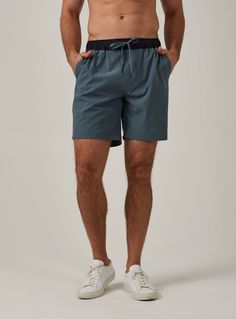 slate-1282 Relaxed Fit 5-inch Inseam Sports Activewear, Sporty Recycled Polyester Bottoms With Relaxed Fit, Sporty Relaxed Fit Bottoms In Recycled Polyester, Casual Training Bottoms In Technical Fabric, Casual Training Shorts In Recycled Polyester, Casual Workout Bottoms In Technical Fabric, Athleisure Bottoms With Functional Pockets In Recycled Polyester, Relaxed Fit Go-dry Shorts In Recycled Polyester, Casual Workout Bottoms In Recycled Polyester