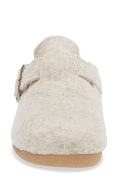 A soft wool-blend footbed enhances the everyday comfort of a clog slipper grounded by a sturdy rubber sole. Adjustable strap with buckle closure Wool and polyester upper and lining/rubber sole Made in Spain Comfortable Slip-on Slippers With Buckle Closure, Comfortable Slippers With Buckle Closure, Comfortable Slippers With Buckle Closure And Flat Heel, Comfortable Flat Clogs With Buckle Closure, Beige Round Toe Mules With Buckle Closure, Beige Mules With Buckle Closure And Round Toe, Winter Closed Toe Clogs With Textured Footbed, Comfortable Beige Clogs With Textured Footbed, Beige Clogs With Textured Footbed And Flat Heel