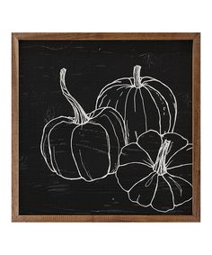 three pumpkins on a blackboard with white paint