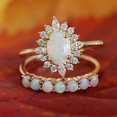 1.1CT Opal Engagement Ring Set 14K Yellow Gold Opal Wedding Ring Set Oval Cut Opal Engagement Ring Oval Wedding Ring, Gift, Anniversary Ring ❋ RING DETAIL ❋ Metal: 925 Sterling Silver (Can be made in Yellow gold & rose gold plated as well) Gemstone -: Opal  Stone Shape-: Oval  Stone Size - : 6x8 mm  Side Stone Size -: 1.50 mm Round + 1.50x3 marquise  ✥Features✥ ✥ Ready to Ship in 5-7  Business Days ✥ I accept custom making order.Please contact me if you need this service. ✥ Please Feel Free to contact us 24*7 to discuss for any order ✥ For all the jewelries,there is a 30 days money back guarantee. ✥ All items will be well packed in a beautiful ring box. ✥ If you want to upgrade your shipping speed then please add this with your product PLEASE BE ADVISED BEFORE PURCHASING: *We can not be he Luxury Yellow Gold Opal Ring With Halo Design, Elegant Oval Cluster Ring For Marriage, Oval Wedding Ring With Prong Setting, Oval Diamond Ring With Halo Setting For Wedding, Oval Halo Diamond Ring For Wedding, Oval Wedding Rings With Diamond Accents, Heirloom Oval Diamond Wedding Ring, Exquisite Oval Diamond Wedding Ring, Oval Cluster Ring For Wedding