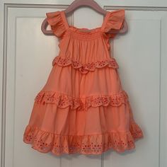 New With Tags! Janie And Jack Baby Girl Eyelet Ruffle Dress. Color Is Peach Amber (Such A Pretty Color). Size 18-24 Months. No Rips, Stains Or Odors. Retail Price: $79. Description From Janie And Jack’s Website: “Warmer Days Are Calling In This Breezy Dress. With A Stretch Smocked Neckline, Ruffle Straps And Tiered Eyelet Details We Love. 100% Cotton Batiste Fully Lined Sleeveless; Button Back Above The Knee Length Bloomer Included (Sizes Up To 18-24m) Machine Washable; Imported” Please See All Playful Tiered Dress With Ruffle Hem, Cute Ruffle Hem Dress For The Beach, Cute Ruffle Hem Dress For Beach, Cute Ruffle Dress With Ruffle Hem For Beach, Playful Sleeveless Ruffle Dress For Spring, Playful Tiered Ruffle Dress, Summer Playtime Twirl Dress With Ruffle Hem, Spring Twirl Dress With Ruffle Hem For Playdate, Spring Tiered Ruffle Dress For Dress-up