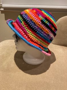 "Paint pour Colorful hand crocheted bucket hat Crown: 6.75\" Height: 8.5\" Width: 11.5\" Head circumference: 21-23\" Material: acrylic" Adjustable Cotton Yarn Crochet Hat With Curved Brim, Adjustable Crochet Hat With Curved Brim In Cotton Yarn, Adjustable Crochet Hat With Flat Brim, Spring Multicolor Crochet Hat With Curved Brim, Multicolor Crochet Sun Hat For Spring, Multicolor Curved Brim Crochet Hat For Spring, Multicolor Brimmed Crochet Hat, Multicolor Wide Brim Crochet Hat For Spring, Spring Multicolor Crochet Sun Hat