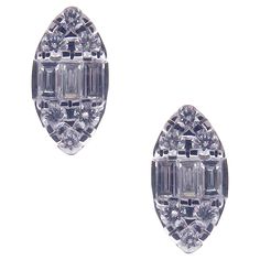 This round and baguette combination diamond illusion marquise-shape stud earring is crafted in 18-karat white gold, featuring 12 round white diamonds totaling of 0.10 carats and 6 baguette white diamonds totaling of 0.09 carats. Approximate total weight 2.45 grams. These earrings come with push back post backings. VS-G Quality natural white diamonds. Luxury White Jewelry With Diamond Markers, Luxury Marquise Diamond Earrings For Women, Luxury Marquise Cut Brilliant Diamond Earrings, Gems Jewelry, White Diamonds, Stud Earring, White Gold Diamonds, Jewelry Earrings Studs, Diamond White