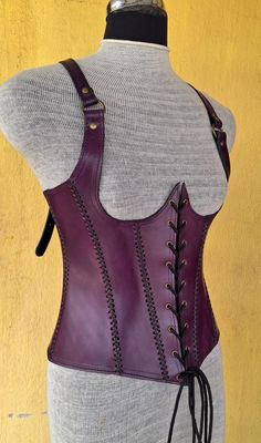 It is handmade leather Under-bust corset with hand-sewn leather detailing. It's adjustable Lace in front side and back side with buckles. We used about 2 to 2.2 mm thick handmade leather. It is hand dyed handmade leather. It is crazy for medieval events and Larp.   Corset is hand made from sturdy top-grain leather.  Bust Size is available  28 Inch to 46 inch DETAILS: ► 100% Handmade ► 100% Genuine leather ► Made on your measurements ► Unique design ► LARP standard ► Worldwide delivery Usually it Steampunk Leather Corset Belt For Cosplay, Steampunk Leather Corset For Cosplay, Gothic Leather Corset For Cosplay, Gothic Leather Corset Belt For Larp, Medieval Leather Fitted Corset, Fitted Leather Medieval Corset, Medieval Style Fitted Leather Corset, Gothic Leather Overbust Corset, Brown Leather Steampunk Corset Belt