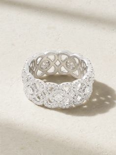 De Beers' ring is part of the label's 'Enchanted Lotus' collection - look closely and you'll see the wide band is made up of the namesake flower. Made from 18-karat white gold, it's set with over 300 diamonds, each of which have undergone a rigorous selection process guided by three pillars of Fire, Life and Brilliance. The brand recommends gently washing yours with warm, soapy water and a cotton cloth to maintain its mesmerizing shine. Gold Ring Price, Rose Diamond Ring, Fire Life, White Diamond Ring, Diamond Cocktail Rings, Vs Diamond, Gold Diamond Ring, White Gold Diamond Rings, Gold Band Ring