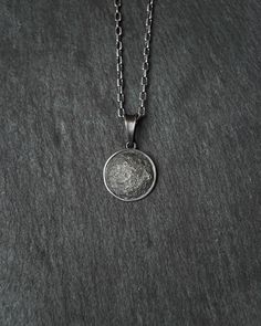 Full Moon silver pendant Metal: Sterling Silver 925 The pendant measures: 16,7 x 16,7 mm Crafted from sterling silver, this exquisite pendant beautifully captures the allure of the full moon. The intricate details highlight the lunar surface, reflecting its celestial charm. Adorn your neckline with this stunning piece, a tribute to the mystique and elegance of the moon's ethereal beauty. Silver Celestial Pendant Jewelry, Celestial Style Silver Round Pendant Jewelry, Celestial Silver Jewelry With Round Pendant, Sterling Silver Sphere-shaped Jewelry, Silver Moon Phase Amulet Jewelry, Silver Celestial Round Necklace, Sterling Silver Moon Charm Pendant Necklace, Silver Moon-shaped Jewelry With Coin Pendant, Sterling Silver Moon Necklace With Coin Pendant