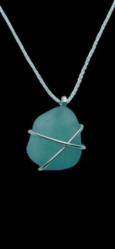 IDEAL CHRISTMAS GIFT!  This delicate handcrafted sea glass pendant is made with a beautifully smoothed deep teal blue nugget found in Kintyre on the west coast of Scotland. The glass is wrapped in 1mm 925  sterling silver wire and is suspended from a hand-formed silver bail.  Choose your preferred chain length at checkout.     Other similar items available: * Pendants https://etsy.me/48jz6JC * Rings https://etsy.me/49nLolF * Tideline Limited Edition https://etsy.me/3y8FBCL * Bangles & bracelets Adjustable Wire Wrapped Necklaces In Recycled Glass, Adjustable Wire Wrapped Necklace In Recycled Glass, Turquoise Wire Wrapped Sea Glass Jewelry, Turquoise Sea Glass Wire Wrapped Jewelry, Wire Wrapped Recycled Glass Jewelry For Gift, Minimalist Recycled Glass Jewelry For Gifts, Sea Glass Round Necklace As Gift, Wire Wrapped Sea Glass Jewelry For Gifts, Wire Wrapped Sea Glass Jewelry Gift