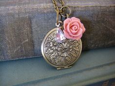 My Mother my friend quote locket comes in this sweet locket with a floral etching. A pink rose dangle and a clear rhinestone dangle swing freely on the chain. The small locket measures 27mm and hangs on a brass chain, you choose the length at checkout. It will arrive prettily packaged for gifting in a box with ribbon. Shipping fees include delivery confirmation with a tracking number. Personalized Pink Locket Necklace For Gift, Personalized Pink Locket Necklace Gift, Vintage Pink Jewelry For Keepsake, Vintage Pink Keepsake Jewelry, Vintage Rose-colored Jewelry For Gifts, Pink Medallion Jewelry As A Gift, Pink Medallion Jewelry Gift, Pink Medallion Jewelry For Gifts, Personalized Vintage Pink Jewelry