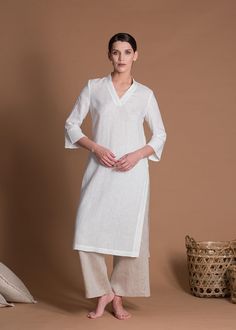 "Custom-made lightweight linen tunic with sleeves in Indian kurta style. This is a fitted tunic, please choose your size carefully from our size chart! 🌿 DETAILS: - Slim fit tunic - 3/4 sleeves - Deep V neckline - High side slits - 100% Natural lightweight linen (125gr/m2) - Wide color palette, color shown is WHITE 🌿 SIZING & FIT Please note that this tunic is meant to be quite fitted and it comes in XS-3XL sizes only, so please check the measurements below carefully. Garments are designed for Elegant White Linen Kurta, Elegant Linen Kurta For Spring, White Linen Straight Kurta, White Linen Fitted Kurta, White Fitted Linen Kurta, Fitted Linen Kurta For Spring, Spring Linen Fitted Kurta, Long Sleeve Linen Kurta For Work, Casual White Linen Kurta