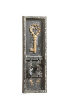 an old door with keys hanging from it's side and keyholes in the middle