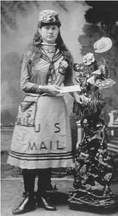 an old black and white photo of a woman holding a mail