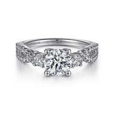 a white gold engagement ring with diamonds on it