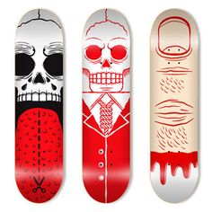 three skateboards with different designs on them, one is red and the other is white