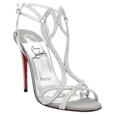 Christian Louboutin Double L Strass Crystal Glitter Sandals are set high on a striking stiletto heel and features two narrow crossed straps in a cursive L shape. Dressed in dazzling crystals, glitter and metallic leather, these sandals evoke regal elegance. CL monogram on the heels. Leather/suede/crystal upper. Round open toe. Adjustable ankle strap. Lacquered leather sole. Brand new, never worn. Comes in original packaging. Made in Italy. Luxury Silver High Heels, Luxury Silver Sandals With Rhinestones, Silver Glitter Sandals For Wedding, Luxury Formal Sandals With Glitter, Luxury Glitter Sandals For Formal Occasions, Luxury Silver Wedding Shoes For Evening, Luxury Sparkling Sandals For Gala, Luxury High Heel Sparkling Sandals, Luxury Sparkling High Heel Sandals