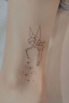 a small fairy tattoo on the ankle