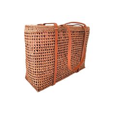 This versatile mesh tote bag is a must-have for any Summer occasion. With its stylish design and convenient size, it's the perfect companion for your resort, beach, or cruise vacation. Its neutral honey color makes it easy to coordinate with any outfit. (PRODUCT INFO): Features drawstring closure Size: 10" height x 14" width x 5" depth inches Fully lined interior with batik print 100% cotton Material: Ata/rattan (SHIPPING INFO): All our items are made-to-order, therefore please allow 3-5 busines Rectangular Beach Bag With Top Carry Handle, Rectangular Bucket Bag With Top Handle For Vacation, Brown Basket Beach Bag With Open Weave, Beach Bucket Bag Tote With Top Carry Handle, Beige Beach Bag With Top Carry Handle For Travel, Beach Bucket Bag With Top Carry Handle, Travel Beach Bag In Beige With Top Carry Handle, Travel Beach Bag With Braided Handles In Brown, Natural Color Tote Bag With Reinforced Handles