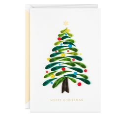 a christmas card with a green tree on it