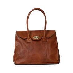 The Antonella Tote Bag is a office-appropriate carryall and that 'something sleek' for your 9-to-5 routine. The stunning cognac leather will develop an authentic patina over time, making it even more luxurious looking. Comes with Hektor + Helena's Lifetime warranty and guarantee. Made of Italian vegetable tanned leather, our bags are all handmade by master craftsmen who have been perfecting their skills for generations. The result is a striking blend of rich earth-toned colors, providing a glowi Classic Double Handle Travel Satchel, Earth Tone Colors, Back In Stock, Longchamp Le Pliage, Vegetable Tanned Leather, Tan Leather, Cognac, Patina, Top Handle Bag