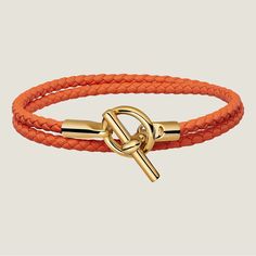 Glenan Double Tour Bracelet Color: Orange Size: T2 Ref: H071689f 93t2 Braided Double Tour Bracelet In Swift Calfskin With Gold-Plated Glenan Closure. Made In Italy Wrist Size From 5.7" To 6.1" | Braid Width: 0.12" Modern Orange Adjustable Bracelets, Hermes Leather Bracelet, 1 Braid, Hermes Bracelet, Hermes Orange, Hermes Jewelry, Hook Bracelet, Leather Chokers, Enamel Bracelet