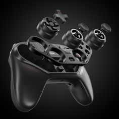 a black controller with four different knobs on it