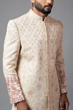 Champagne sherwani with jaal embroidered motifs, sequin and aari, dabka work. Paired with churidar.
Component: 2
Embroidered
Neckline: Mandarin
Sleeve Length: Full
Fabric: Linen Satin, Malai Cotton
Color: Peach
Closure: Concealed buttons
Note: Inner kurta worn by the model is not for sale - Aza Fashions Transitional Bandhgala In Raw Silk With Chikankari Embroidery, Designer Raw Silk Bandhgala With Chikankari Embroidery, Festive Bandhgala With Chikankari Embroidery For Designer Wear, Embroidered Straight Kurta Bandhgala For Reception, Festive Designer Sherwani With Chikankari Embroidery, Festive Bandhgala With Zari Work, Bollywood Bandhgala With Floral Embroidery For Transitional Season, Festive Bandhgala With Zari Work In Traditional Fit, Festive Raw Silk Bandhgala With Floral Embroidery