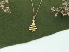 Christmas Tree Necklace in 14K Solid Gold, Gold Pine Tree Pendant, Dainty Charm Necklace, Noel Gifts, Christmas Gift Jewelry, Xmas Necklace -Features- * Made to order * Material: Solid Gold (no gold filled or gold plated material) * Carat: 14K (585) (real gold) * Production Techniques: Handmade and Laser Cut * Package: Jewelry Box This beautiful 14K Solid Gold handmade necklace is the ideal gift for a loved one. Perfect for birthdays, anniversaries, Mother's Day, Christmas and weddings, it truly is extra special and will make whoever receives it feel extra special too.  / WHY YOU'LL LOVE / * Elegant and can be worn every day * A special piece that you can appreciate * High quality 14K Solid Gold and attention to detail Gold Necklace For Festive Christmas Occasion, Christmas Celebration Yellow Gold Jewelry, Hallmark Necklace For Christmas And Anniversary, Gold Necklaces For Christmas Celebration, Quality Assured Necklace For Christmas Anniversary, Gold Necklace For Christmas Celebration, Christmas Gift Jewelry Hallmarked, Hallmarked Jewelry For Christmas Gift, Yellow Gold Necklaces For Christmas Anniversary