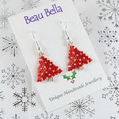 These classy Christmas tree earrings have been handmade using tiny red and silver glass seed beads. The finishing touch for your Christmas day outfit, an ideal 'secret Santa' or stocking filler gift. The tree measures around by 2 cm (3/4 inch) wide by 2.5 cm (1 inch) long. Approximate drop length is 4 cm (1 1/2 inches) from the top of the hook to bottom of the tree.  The trees are hung from your choice of silver plated or solid sterling silver ear hooks - please select from the drop down 'materi Red And Silver Christmas Tree, Colourful Christmas Tree, Red And Silver Christmas, Bead Trees, Festive Earrings, Colourful Christmas, Christmas Jewellery, Christmas Day Outfit, Silver Christmas Tree