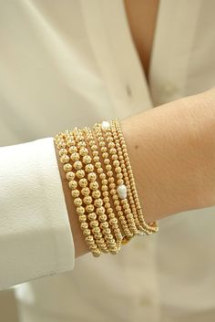 **ANNIVERSARY MONTH SALE UP TO 20% OFF ON SELECTED ITEMS OR BUY ANY THREE (3) ITEMS AND GET 15%OFF ON YOUR ENTIRE PURCHASE ** Gold Bead Bracelet, Beaded Bracelet, Gold Bracelet Stack, Stacking Bracelet 2mm 3mm 4mm, Dainty Bracelet Classic gold bead bracelet is a perfect addition to a dainty stack this spring/summer season. The beads are strung on a premium stretch cord. SOLD BY ONE BRACELET ITEMS DETAILS: Water Resistant -Nickel-free - Allergy-free - - High-Quality 18K gold plated brass beads ma Stackable Round Bead Pearl Bracelet For Everyday, Stackable Pearl Bracelet With Round Beads, Dainty Stackable Round Bead Bracelets, Dainty Hypoallergenic Bracelets With Round Beads, Dainty Stackable Bracelets With Round Beads, Dainty Stackable Pearl Bracelet With Round Beads, Dainty Hand-strung Pearl Bracelet With Round Beads, Stackable Pearl Bead Bracelet As A Gift, Stackable Round Bead Pearl Bracelet As Gift