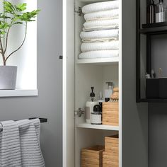 the bathroom is organized and ready to be used as a storage area for towels or other items