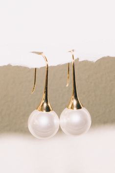 pearl drop earrings wedding on white background Minimalist Pearl White Earrings For Party, Pearl White Pearl Earrings For Evening, Minimalist Pearl Drop Earrings For Party, Minimalist Pearl Earrings For Parties, Modern Formal Earrings With Pearl Pendant, Elegant Pearl Earrings With High Luster For Evenings, Luxury Drop Pearl Earrings For Evening, Luxury Yellow Gold Drop Pearl Earrings, Luxury Long Drop Pearl Earrings