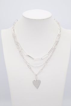 This necklace is a fun accessory to wear every day! It's a silver chain with a heart charm. The heart charm is a great way to add a little bit of romance to your outfit. Trendy Heart Pendant Necklace With Silver Chain, Valentine's Day Silver Charm Necklace With Chain, Valentine's Day Silver Charm Necklace, Silver Heart Pendant Chain Necklace With Adjustable Chain, Trendy Heart Shaped Silver Chain Necklace, Trendy Heart-shaped Silver Chain Necklace, Trendy Silver Chain Necklace With Heart Pendant, Trendy Silver Open Heart Necklace, Valentine's Day Silver Heart Necklace With Chain