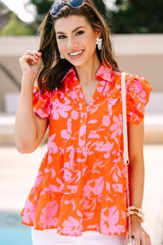 This blouse is so worth your while! It's absolutely adorable! That bold floral print is absolutely precious! We know you are going to love that button down fit as well! Especially since it can be paired with everything form sandals to... Spring Vacation Blouse With Button Closure, Vacation Floral Print Button-up Blouse, Summer Floral Print Button-up Blouse, Summer Blouse With Button Closure For Day Out, Summer Day Out Blouse With Button Closure, Feminine Button-up Blouse For Vacation, Summer Blouse With Buttons For Brunch, Trendy Summer Floral Print Blouse, Trendy Blouse With Tropical Print For Spring