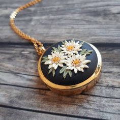 Mothers Day Locket Necklace, Mothers Day Gift, Mothers Day Keepsake FREE FEDEX priority shipping takes: 2-3 WORKDAYS ( USA). This is a vintage style, unique, handmade, polymer clay locket necklace with edelweiss flowers motif. This beautiful romantic, photo locket necklace is a piece of original and unique artwork. It's a perfect gift idea for mom, for wife. The base of the locket is gold color, brass alloy. The photo locket is openable, you can insert a picture or some small souvenir from your Vintage Charm Necklace For Mother's Day, Vintage Charm Necklace For Mother's Day Anniversary, Vintage Charm Necklaces For Mother's Day Anniversary, Vintage Charm Necklaces For Anniversary And Mother's Day, Vintage Flower Charm Necklace For Gift, Vintage Flower Pendant Jewelry As Gift, Vintage Charm Flower Pendant Jewelry Gift, Vintage Charm Jewelry With Flower Pendant For Gift, Flower Shaped Necklace With Vintage Charm As Gift