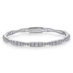 Add a little majestic flair to your bracelet stacking with this sparkling bangle style from our Demure collection. Comprised of a delicate 14K white gold base, its entire foundation is adorned with 1.87 ct diamonds that encompass the circumference in a graduating design feature. With just the right amount of sparkle to spare, this bangle is modest enough to pair with multiple bracelets while also stunning as a solo accessory. Elegant Diamond Stackable Cuff Bracelet, Stackable White Gold Cubic Zirconia Diamond Bracelet, Stackable Cubic Zirconia Diamond Bracelet In White Gold, Formal Stackable Diamond Bracelet, Elegant Stackable Diamond Tennis Bracelet, Elegant Diamond White Stackable Bracelets, Elegant Gold Diamond Stackable Bracelet, Wedding Diamond Stackable Tennis Bracelet, Wedding Stackable Diamond Tennis Bracelet