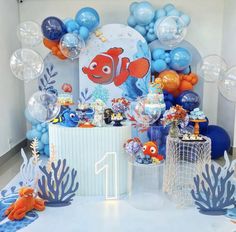 an under the sea themed birthday party with balloons and decorations