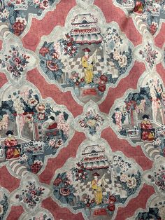 a red and blue wallpaper with an ornate design