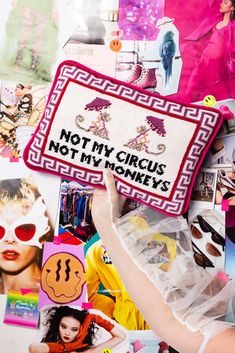 a woman holding up a pillow that says not my circus, not my money