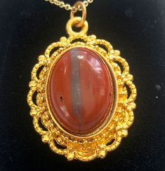 Pendant stone size is 13x18 mm.  Jasper is classified as an opaque, impure variety of silica from the family of quartz. It can come in almost any color but most commonly as red, yellow, brown or green. It can be found worldwide. Jasper is known to have been a favorite gem in the ancient world; its name can be traced back in Arabic, Persian, Hebrew, Assyrian, Greek and Latin.  Free shipping via USPS First Class Mail to United States addresses! All our items are NICKEL FREE, CADMIUM FREE and LEAD Handmade Oval Gold Gemstones, Formal Oval Cabochon Natural Stone Jewelry, Gold Oval Gemstones With Large Stone, Formal Jewelry With Oval Cabochon Natural Stones, Gold Agate Hallmarked Jewelry, Antique Oval Agate Jewelry, Collectible Oval Amber Necklaces, Vintage Gold Cabochon Gemstones, Gold Jewelry With Large Oval Cabochon Stone